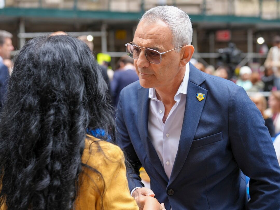 Two business professionals shaking hands during a networking meeting